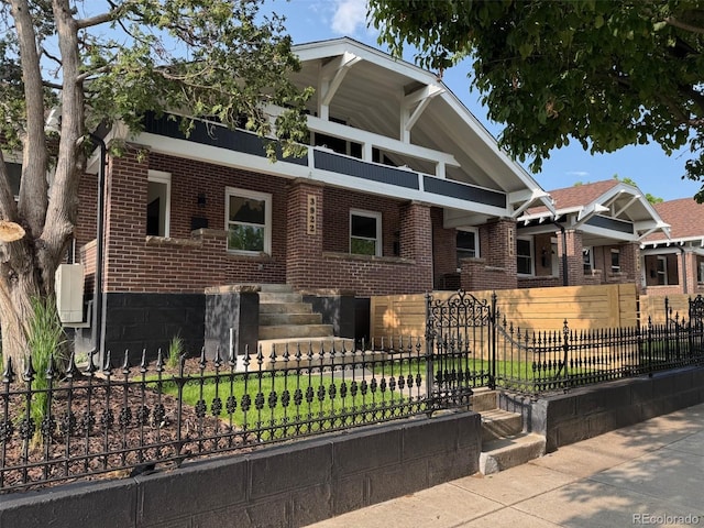 3922 W 29th Ave, Denver, CO 80212 - view of front of home featuring brick siding and a fenced front yard