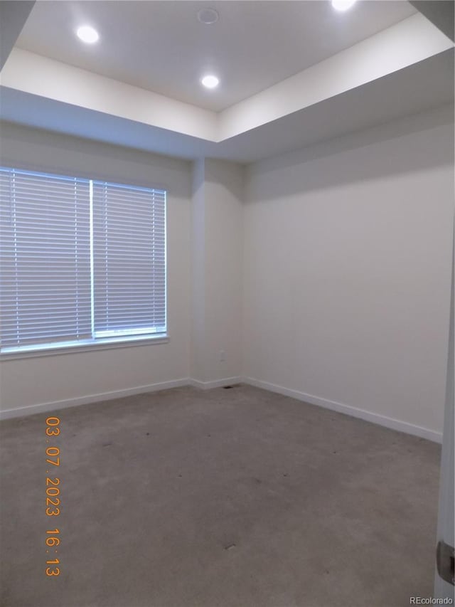 unfurnished room featuring recessed lighting, carpet, and baseboards