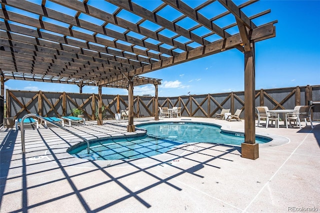 pool with a pergola, a patio, and fence