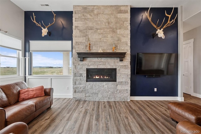 19751 Good Life Vw, Calhan, CO 80808 - living area with wood finished floors, a fireplace, and baseboards