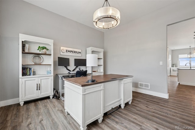 19751 Good Life Vw, Calhan, CO 80808 - home office with a chandelier, dark wood-type flooring, baseboards, and a sink