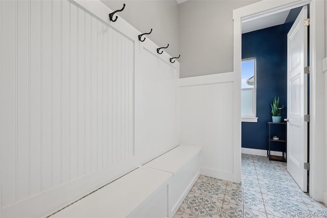 19751 Good Life Vw, Calhan, CO 80808 - mudroom featuring light tile patterned flooring and a wainscoted wall