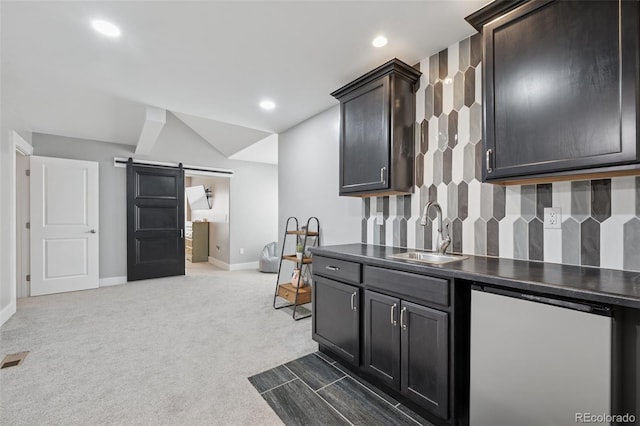 19751 Good Life Vw, Calhan, CO 80808 - kitchen with a sink, a barn door, fridge, baseboards, and dark colored carpet
