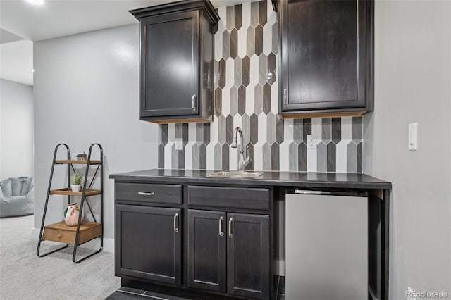19751 Good Life Vw, Calhan, CO 80808 - indoor wet bar featuring refrigerator, decorative backsplash, carpet flooring, and baseboards