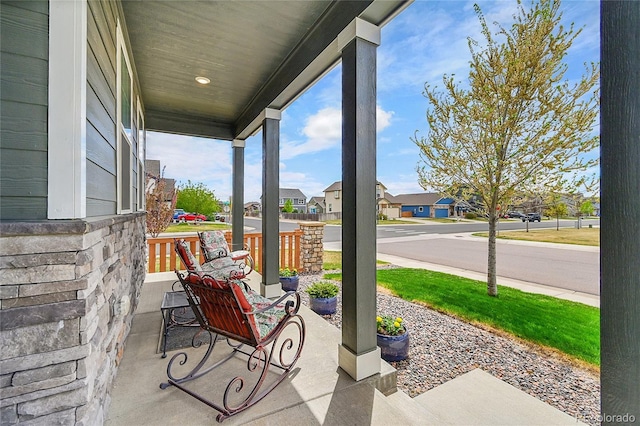 view of patio with a porch and a residential view