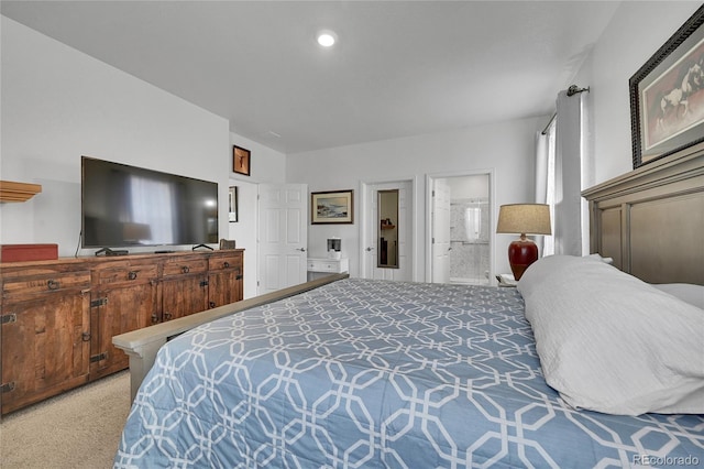 bedroom with carpet and ensuite bath