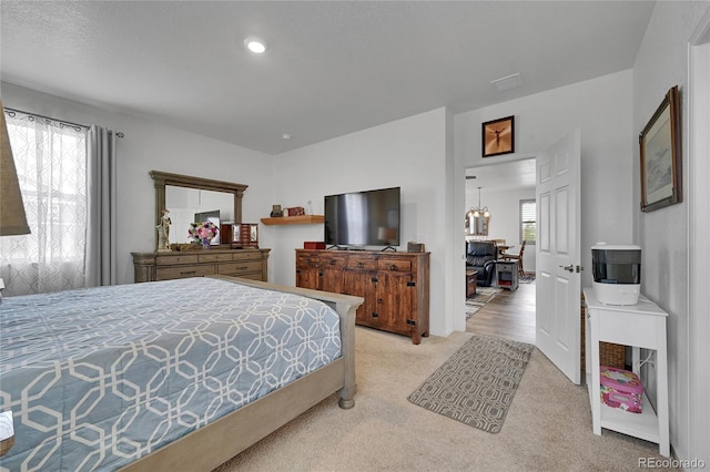 bedroom with light colored carpet