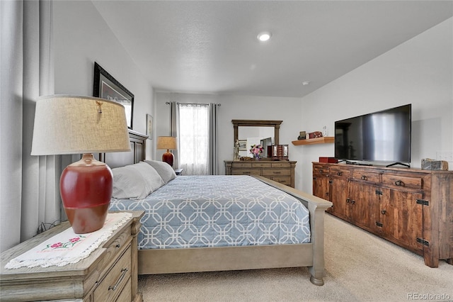 bedroom featuring light carpet