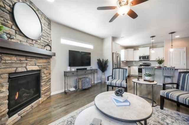 3326 Daydreamer Dr, Colorado Springs, CO 80908 - living room with a fireplace, wood finished floors, ceiling fan, and recessed lighting