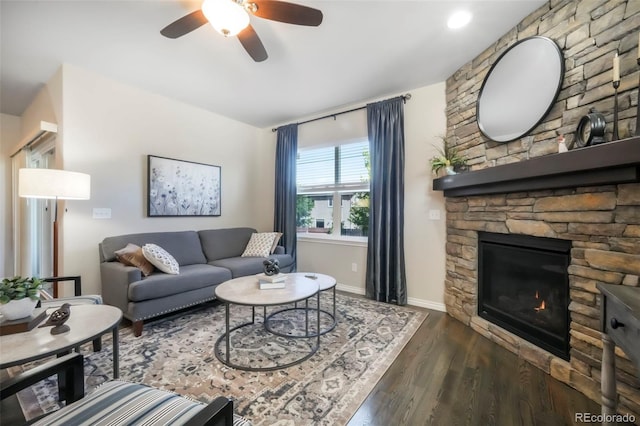 3326 Daydreamer Dr, Colorado Springs, CO 80908 - living area with ceiling fan, wood finished floors, and a stone fireplace