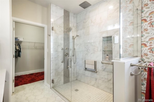 3326 Daydreamer Dr, Colorado Springs, CO 80908 - full bathroom featuring a shower stall, a spacious closet, and tile patterned flooring