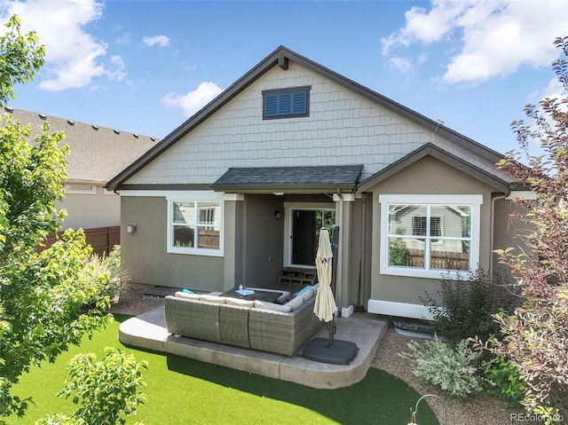 3326 Daydreamer Dr, Colorado Springs, CO 80908 - back of property featuring an outdoor hangout area, stucco siding, and a patio