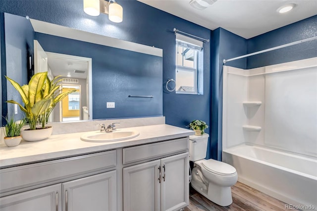 3429 Hardin St, Castle Rock, CO 80109 - full bathroom featuring toilet, wood finished floors, vanity, and shower / tub combination