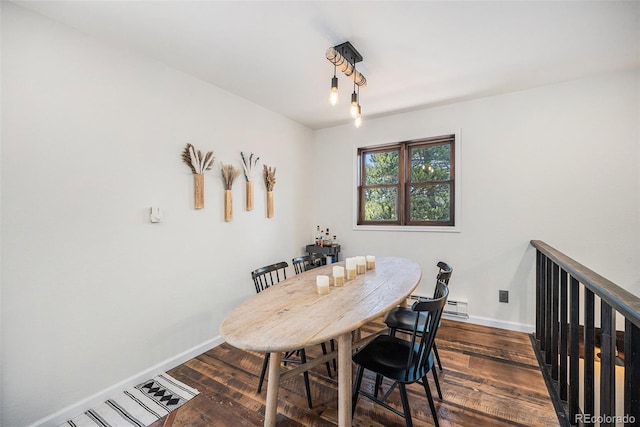 11557 Green Cir, Conifer, CO 80433 - dining space featuring dark wood-style flooring and baseboards