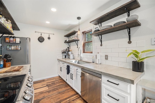 11557 Green Cir, Conifer, CO 80433 - kitchen featuring stainless steel appliances, a sink, open shelves, decorative backsplash, and dark wood-type flooring