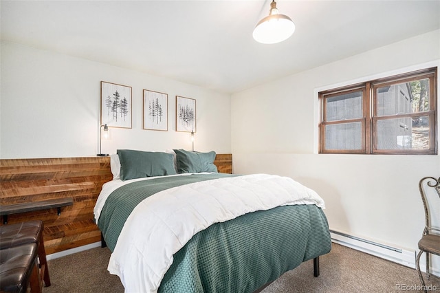 11557 Green Cir, Conifer, CO 80433 - bedroom featuring baseboard heating and carpet flooring