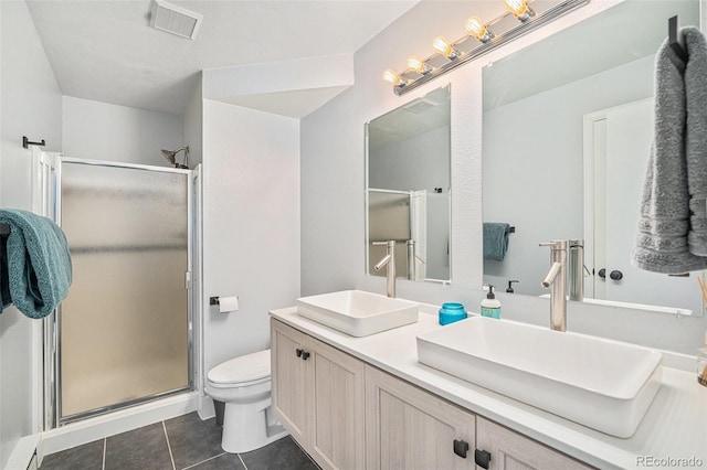 11557 Green Cir, Conifer, CO 80433 - bathroom featuring tile patterned flooring, a shower stall, toilet, and double vanity
