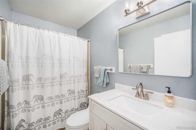 11557 Green Cir, Conifer, CO 80433 - bathroom with toilet, vanity, curtained shower, and a textured ceiling