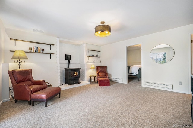 11557 Green Cir, Conifer, CO 80433 - living area with a wood stove, baseboard heating, carpet, and baseboards