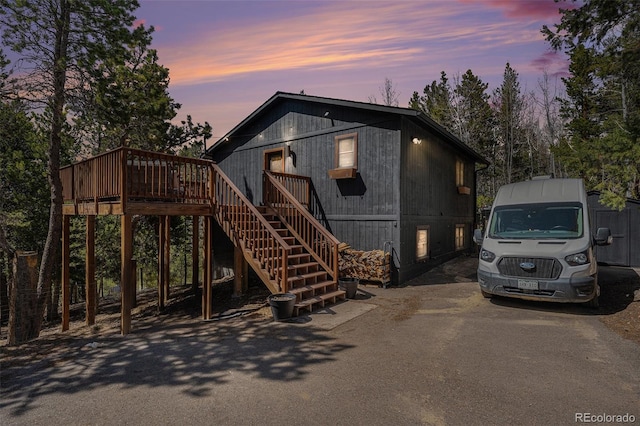 11557 Green Cir, Conifer, CO 80433 - rustic home featuring stairs and a deck