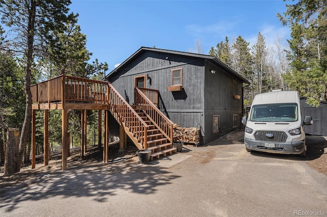 11557 Green Cir, Conifer, CO 80433 - exterior space with stairway and a deck