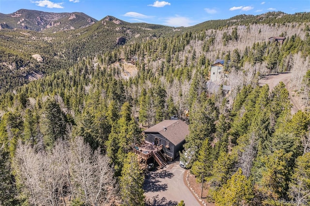 11557 Green Cir, Conifer, CO 80433 - view from above of property featuring a heavily wooded area and mountains