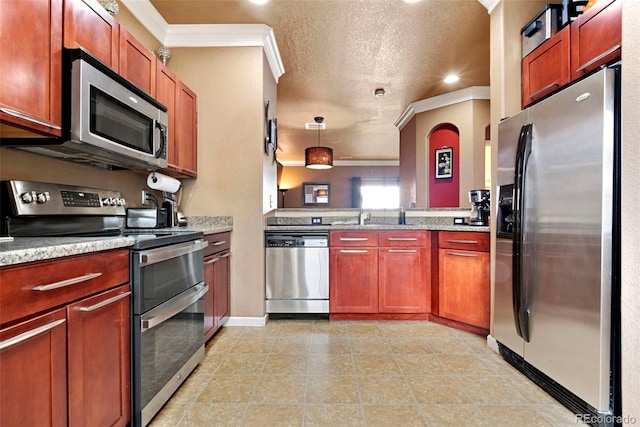 kitchen with light tile patterned floors, baseboards, light stone counters, crown molding, and appliances with stainless steel finishes