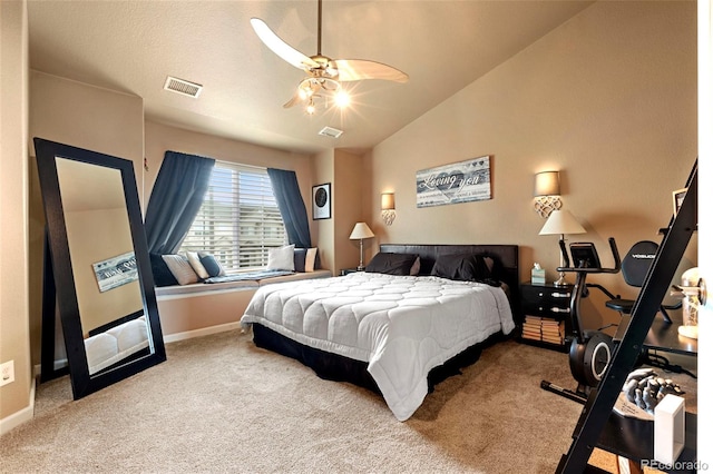 carpeted bedroom with visible vents, baseboards, and lofted ceiling
