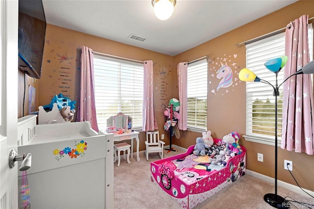 bedroom featuring baseboards, visible vents, and carpet floors
