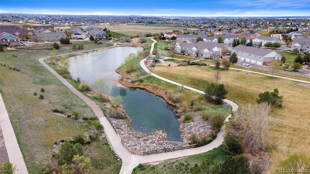 birds eye view of property featuring a water view and a residential view