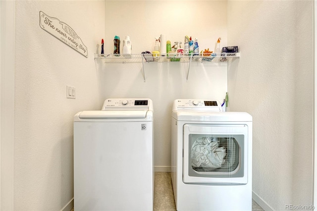 clothes washing area featuring washer and dryer