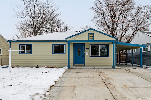 view of front of property with a carport