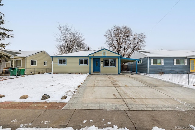 view of front of property featuring a carport