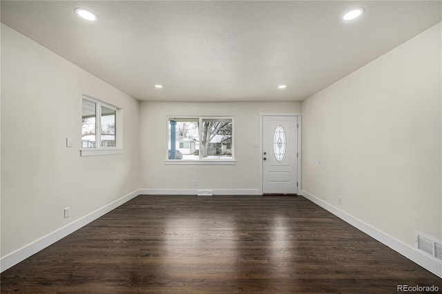 foyer entrance featuring dark hardwood / wood-style flooring