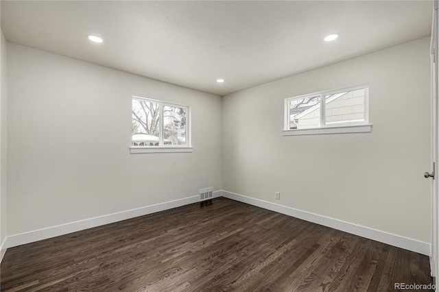 empty room with dark wood-type flooring