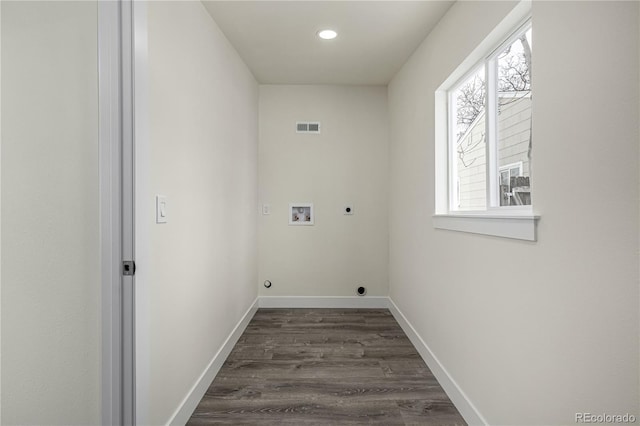 laundry room featuring dark hardwood / wood-style floors, hookup for a washing machine, a wealth of natural light, and hookup for an electric dryer