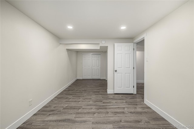 corridor featuring hardwood / wood-style floors