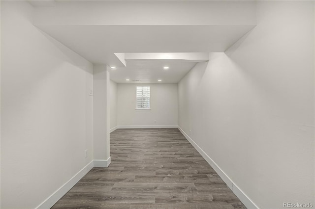 basement with hardwood / wood-style flooring