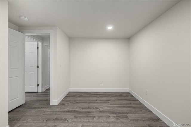 empty room with dark hardwood / wood-style floors