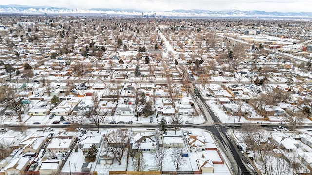 snowy aerial view featuring a mountain view