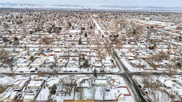 snowy aerial view with a mountain view