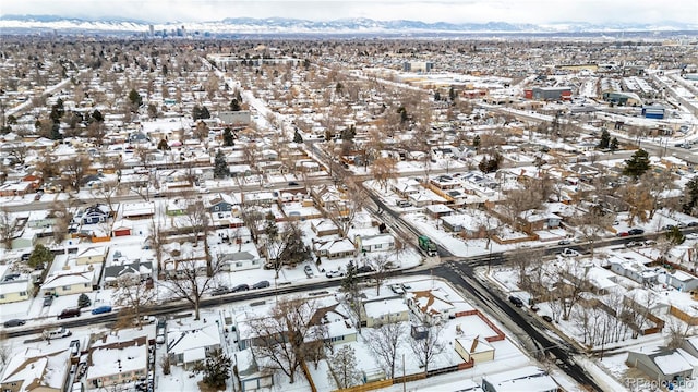 snowy aerial view with a mountain view