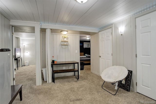 interior space with light carpet and wooden ceiling