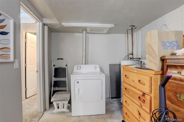 clothes washing area with washer / dryer