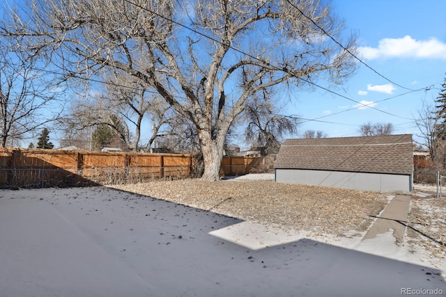 view of yard layered in snow