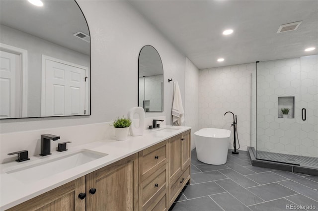 867 Hill And Dale Rd Unit B, Golden, CO 80401 - bathroom featuring a freestanding bath, double vanity, a shower stall, recessed lighting, and tile patterned floors