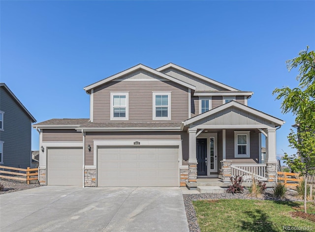 1953 Morgan Dr, Erie, CO 80516 - craftsman inspired home with a porch, concrete driveway, stone siding, and a garage