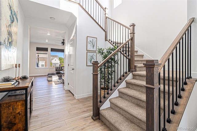 1953 Morgan Dr, Erie, CO 80516 - staircase with wood finished floors, ceiling fan, baseboards, and recessed lighting