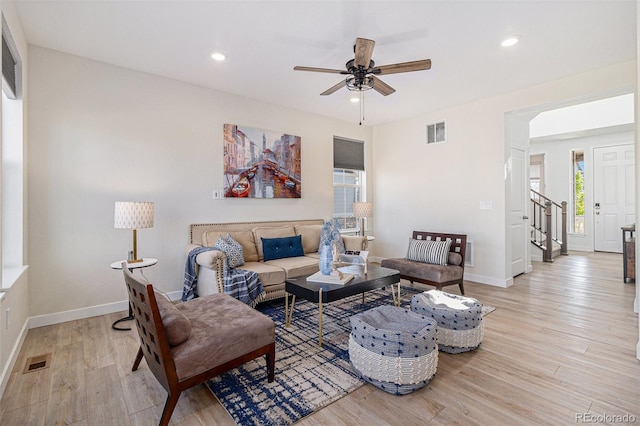 1953 Morgan Dr, Erie, CO 80516 - living room featuring a ceiling fan, light wood-style flooring, baseboards, recessed lighting, and stairway