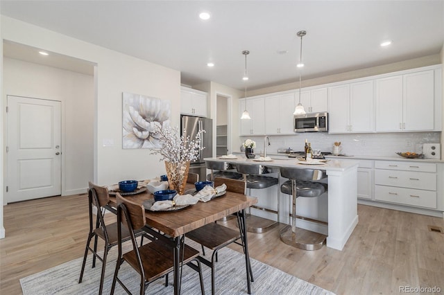 1953 Morgan Dr, Erie, CO 80516 - dining space featuring light wood-style floors and recessed lighting